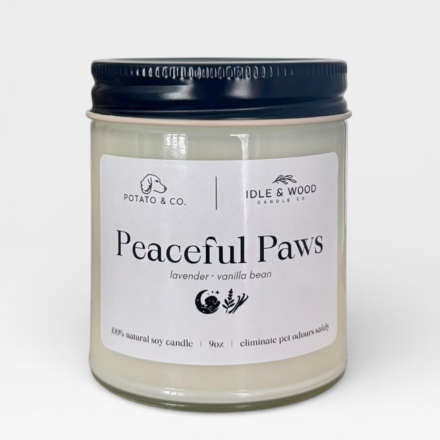 Candle jar labeled 'Peaceful Paws' by Idle & Wood on a white background