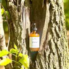 Load image into Gallery viewer, Bottle of insect repeelent spray on a tree trunk
